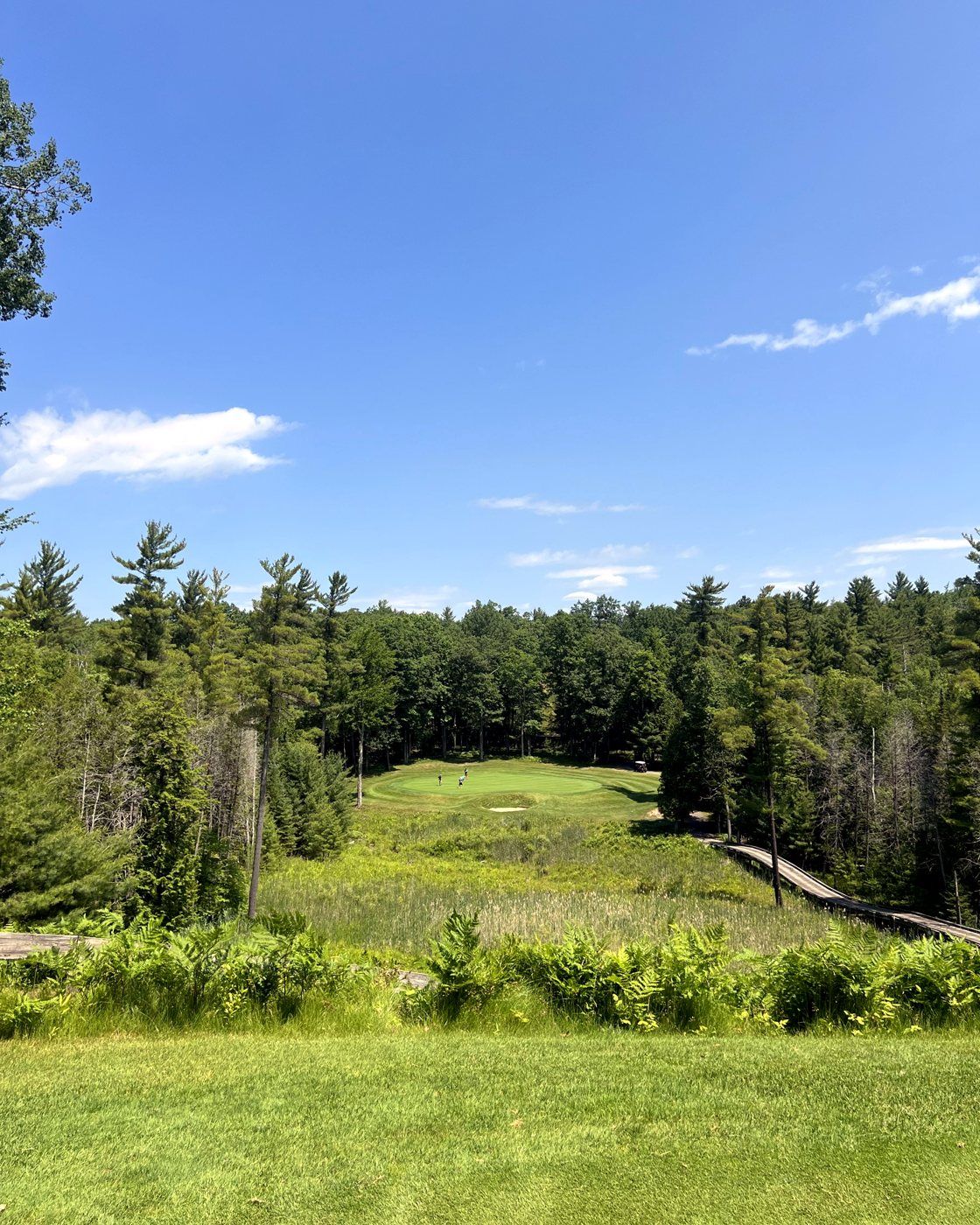 Red Hawk's third hole under a blue sky